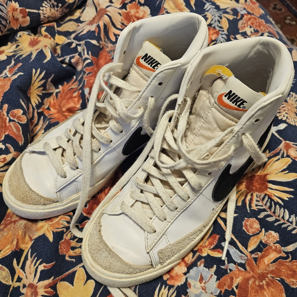 Nike White High-Top Sneakers with Black Swoosh and Yellow Accents